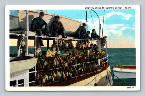 Men on boat with ducks strung up
