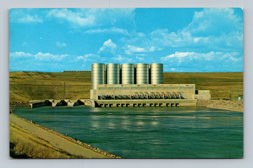 Antique postcard of Garrison Dam in Riverdale North Dakota showing powerhouse and outlet tunnels
