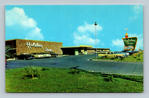 Holiday Inn hotel building with air-conditioned swimming pool and restaurant in Laredo Texas