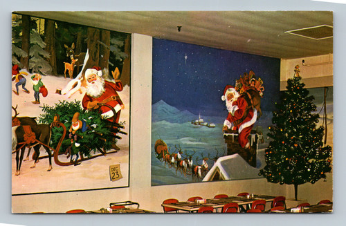 The Christmas Dining Room at Santa Claus Land decorated with Christmas tree and murals