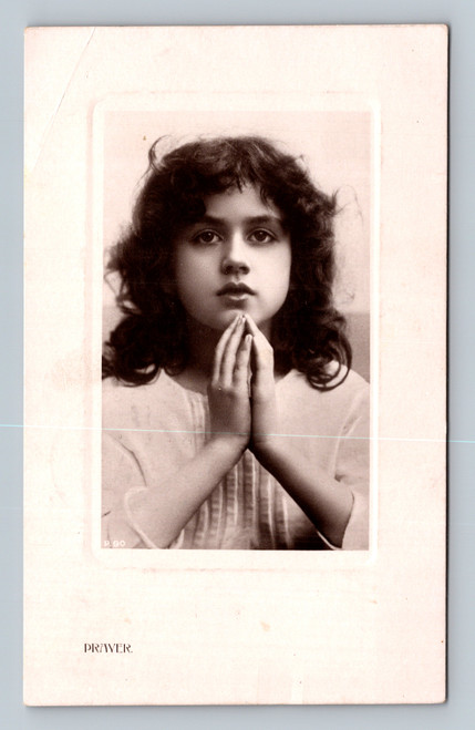 Antique RPPC Prayer postcard featuring devotional child portrait with clasped hands