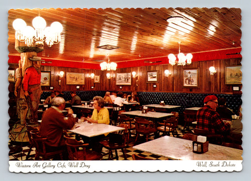 Wooden carvings of Butch Cassidy and the Sundance Kid at Wall Drug Western Art Gallery Cafe
