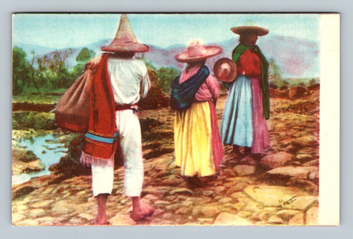 three people walking on a rural path in mexico