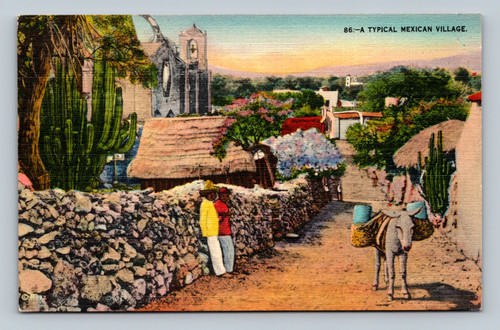 Typical Mexican village scene people along wall burro with cargo