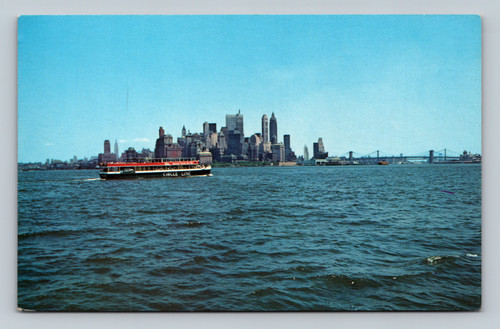 Circle Line yacht at Pier 83 with downtown Manhattan skyline in New York City