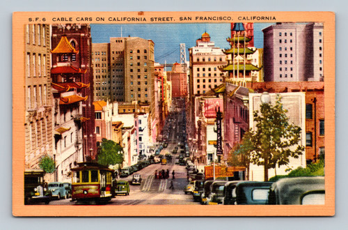6 cable cars on California Street with Old St. Mary's Church and San Francisco-Oakland Bay Bridge tower