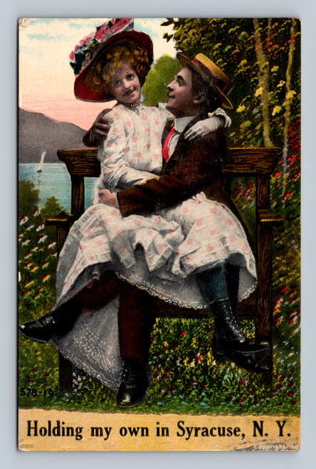 Person holding own in Syracuse New York vintage postcard