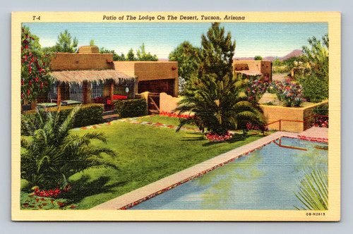 Patio of The Lodge On The Desert resort hotel in Tucson Arizona with flower-bordered patios and palm-thatched porches