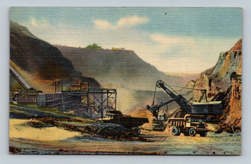 Euclid 15-ton trucks loading iron ore at Weggum Mine Hibbing Minnesota
