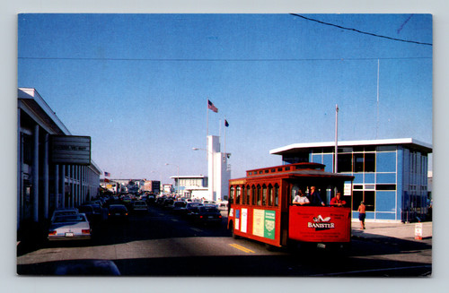 View looking north on Ocean Boulevard at Hampton Beach showing the new facade of the Casino, the Sea Shell, and a trolley