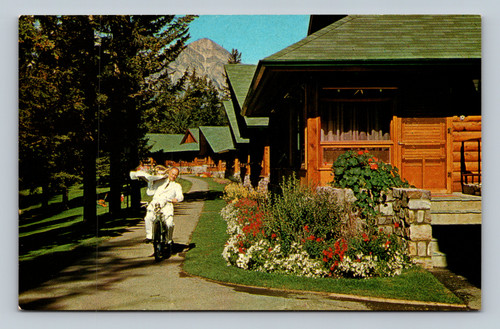 Room service at Jasper Park Lodge with bungalows and Pyramid Mountain in background