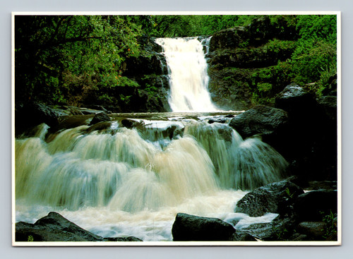 Cascading waters of Waimea Falls in Waimea Falls Park on Oahu's North Shore