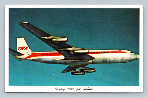 Boeing 707 jet airliner flying over Chicago skyline