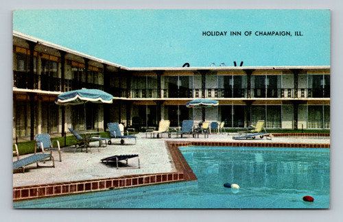 Holiday Inn hotel building with swimming pool and patio in Champaign Illinois