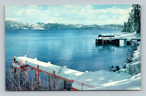 Winter snow decorates the beautiful shoreline of Lake Tahoe California