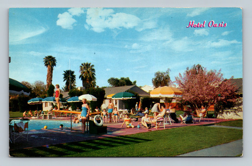 Oasis Hotel pool and blooming Orchid Tree in Palm Springs California