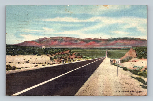 Highway U.S. 66 entering Rio Grande Valley at Albuquerque with Sandia Mountains in the background