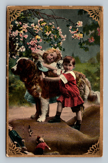 Two children with St. Bernard in garden setting