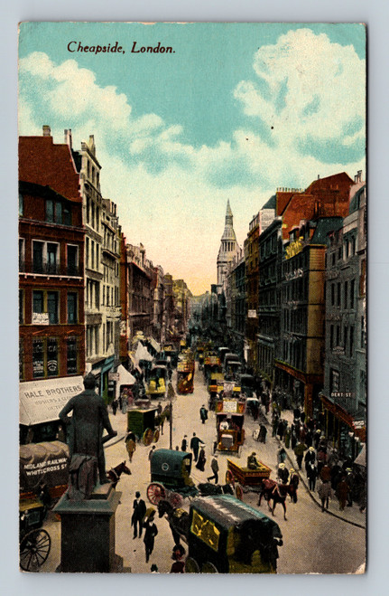 Color antique postcard showing busy Cheapside in London with pedestrians, horse-drawn vehicles, early buses and St. Pauls Cathedral visible in the distance.