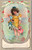 Girl holding dolls standing in sea during summer