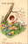 Young girl in yellow dress with lamb and colored eggs