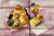 Five chics breaking through puprle package