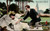 Antique comic postcard showing humorous picnic scene with couple outdoors
