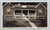 Couple with their dog sitting on the porch steps of their craftsman bungalow home. Vintage black and white photo