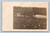 Antique RPPC farmer using horse drawn plow team in field rural scene