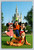 Mickey, Minnie, Goofy and Pluto welcoming guests with Cinderella Castle at Walt Disney World