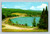Willoughby Beach picnic area with log cabin accommodations in Westmore, Vermont
