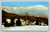 The Lodge at Smugglers Notch with snow clad Mt. Mansfield and ski trails in Stowe Vermont