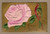 Antique embossed Best Wishes postcard with pink rose colorful bird and gold background