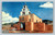 San Miguel Church with San Jose Bell and stone buttresses in Santa Fe New Mexico