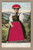 Vintage German postcard showing a woman in traditional Gutach Black Forest costume with a red Bollenhut and applied red fabric apron.