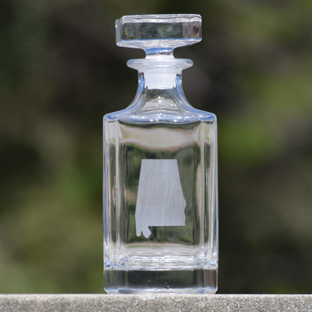 Alabama etched glass decanter for whiskey or bourbon, featuring state silhouette design on a 24 oz barware gift, displayed on a home bar or bar cart.