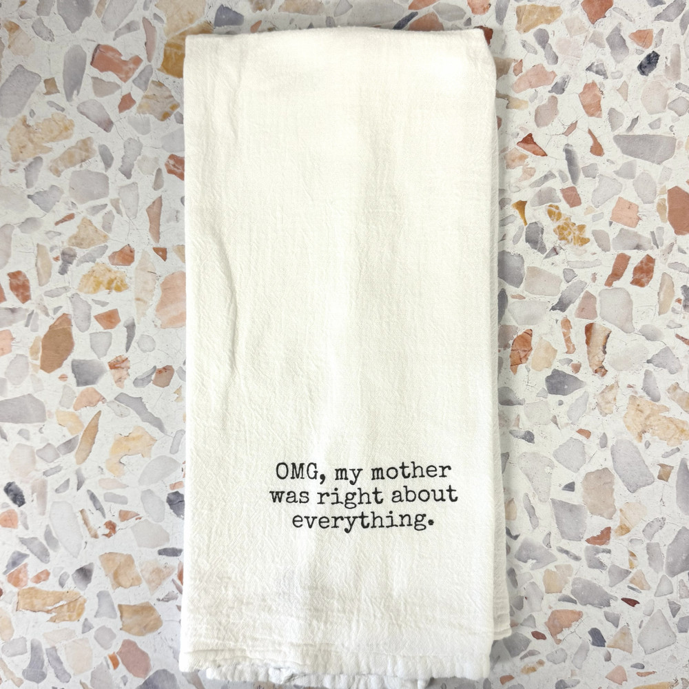 Funny mom kitchen towel in blue flour sack cotton, styled in a bright kitchen setting, showcasing printed humor design, Alabama-made gift item