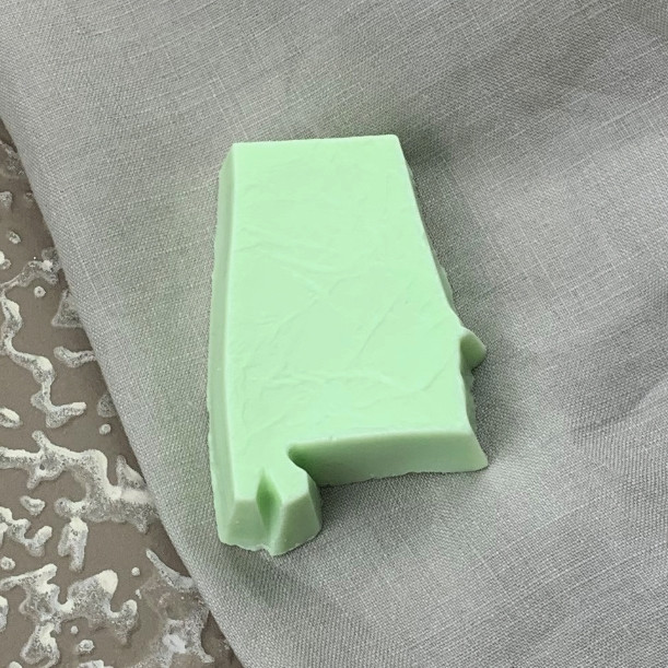 Handmade Alabama-shaped shea butter soap in kiwi cucumber fragrance, artisan crafted in Sheffield, Alabama, for gifts, guest baths, and Southern gift baskets.