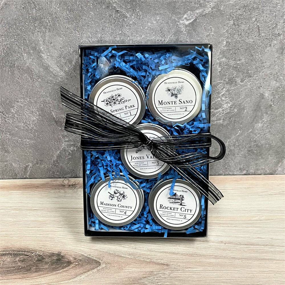 Huntsville soy candle tin gift set with five Alabama-inspired scents in small metal tins