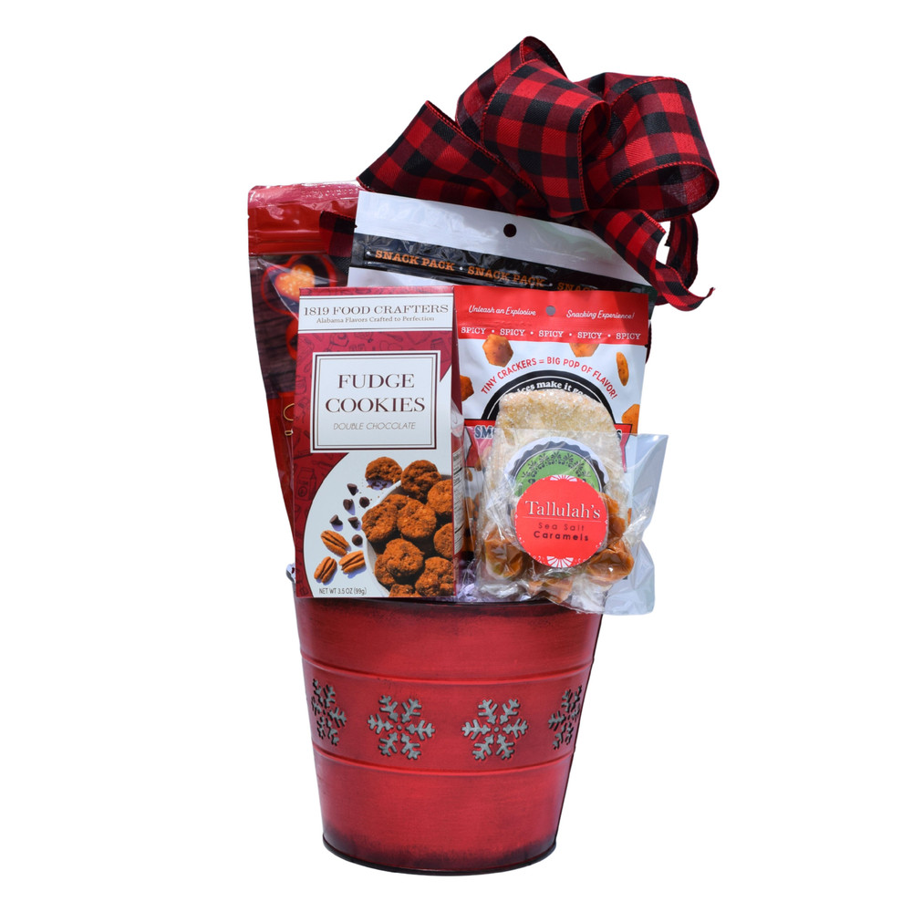 Warm Wishes Alabama holiday gift basket with chocolate cookies, spicy poppers, BBQ crackers, Christmas snack mix and cocoa in red snowflake bucket