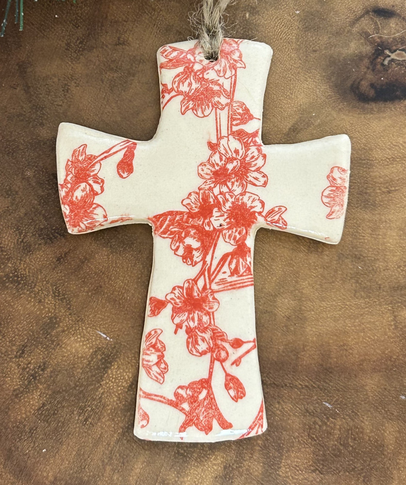 Monochromatic floral cross ornament handcrafted in Alabama pottery style
Faith Patterson ceramic cross ornament close-up with floral design
Elegant monochrome cross ornament hanging display home décor
Handmade Alabama pottery cross gift religious décor