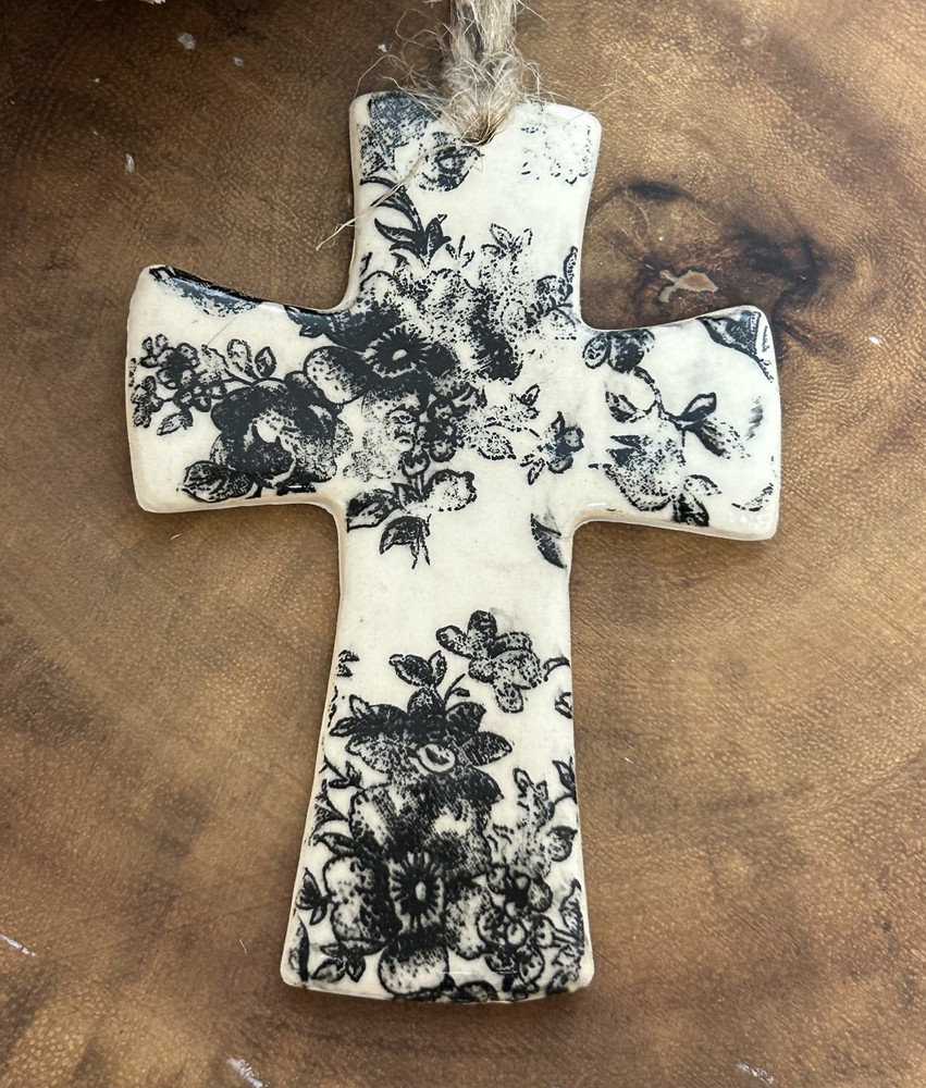 Monochromatic floral cross ornament handcrafted in Alabama pottery style
Faith Patterson ceramic cross ornament close-up with floral design
Elegant monochrome cross ornament hanging display home décor
Handmade Alabama pottery cross gift religious décor