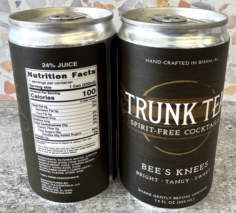 Refreshing non-alcoholic Bee’s Knees cocktail with lemon, honey, and juniper, beautifully bottled for an elegant alcohol-free drink experience