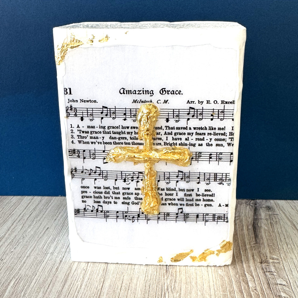 Amazing Grace hymn block art with gold cross handcrafted in Alabama, displayed on shelf as inspirational Christian home décor gift.