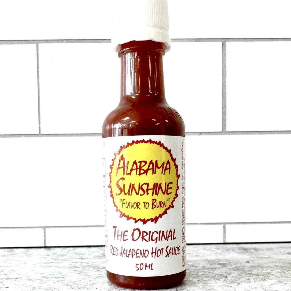 Alabama Sunshine original hot sauce mini 50ml bottle made in Alabama with red jalapeños, mild heat gourmet hot sauce for gifts and events