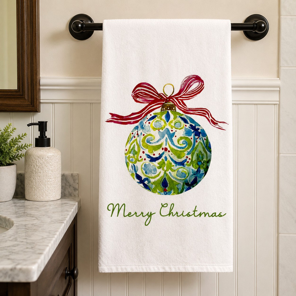 Christmas ornament flour sack tea towel with watercolor-style blue and green ornament, red ribbon and Merry Christmas lettering on white fabric.
