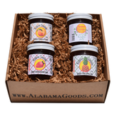 Alabama Jelly Sampler gift box with Kudzu Jelly, Spicy Strawberry Jam, Sassy Pineapple Jam, and Spiked Vanilla Peach Jam.