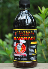 Grilled steak marinated with Pilleteri’s marinade, Alabama gourmet marinade bottle, premium steak marinade in glass bottle, Southern grilling sauce close-up