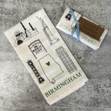 Birmingham icon tea towel hanging in a kitchen with visible design and cotton texture; close-up of Birmingham artwork on flour sack towel; styled Alabama gift towel folded on counter; decorative Birmingham towel in home setting