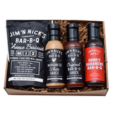Jim 'N Nick's Alabama BBQ gift set with white sauce, original barbecue sauce, honey habanero sauce and cheese biscuit mix in a gift box.